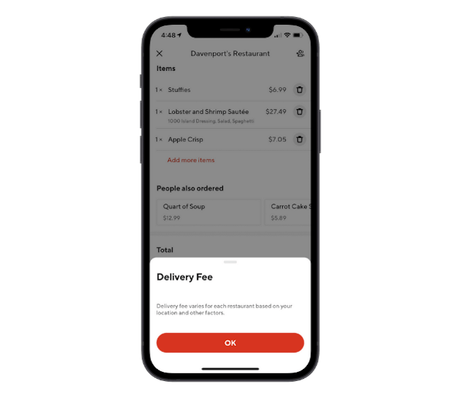 DoorDash app’s explanation of its delivery fee appears as an overlay on the order page.