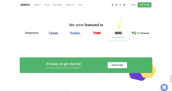 The Brand24 home page has a section called “We were featured in”. There are logos for Entrepreneur, Clutch, Forbes, TNW, ADWEEK (which has a yellow arrow pointed at it with the words “Read the review” under it), and TechCrunch.
