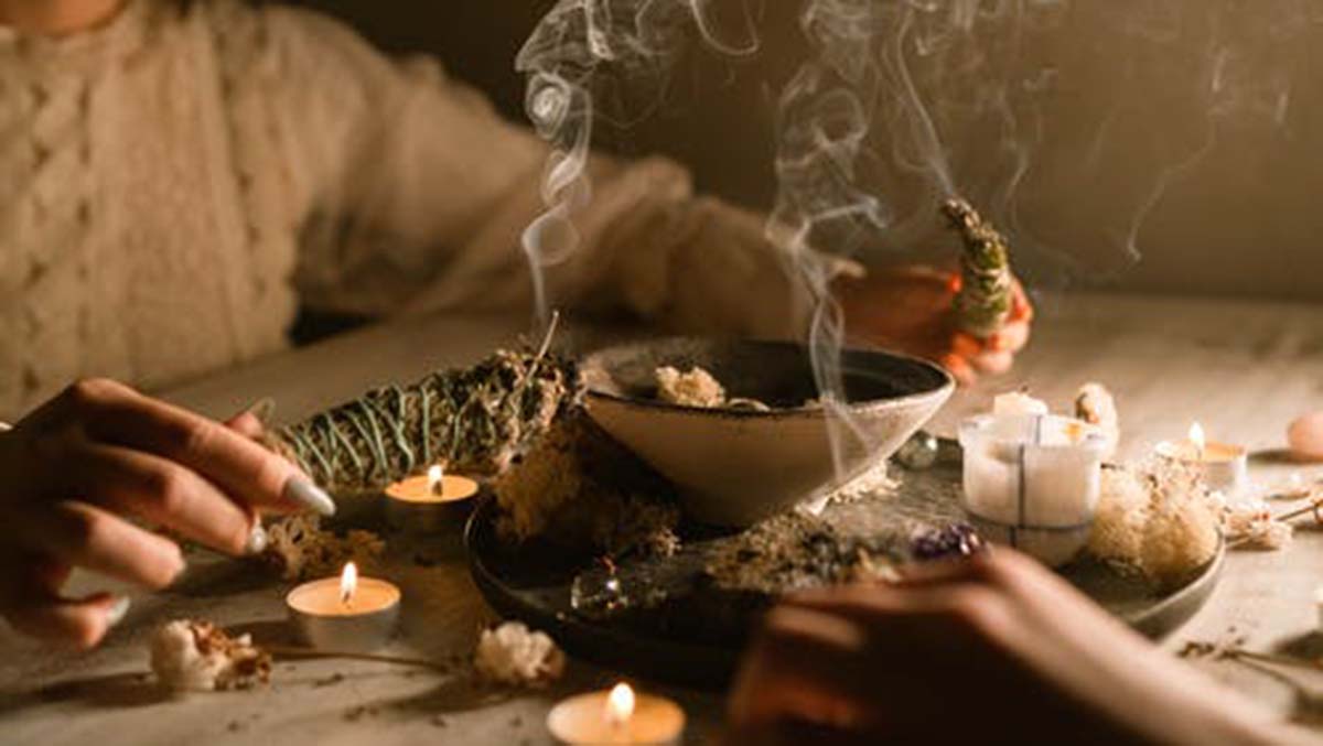 image of incense and candles to signify dark magic