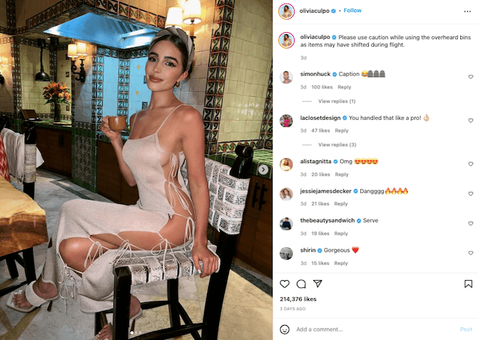 An Instagram post from influencer @oliviaculpo. The caption reads “Please use caution while using the overhead bins as items may have shifted during flight.” On the left is a photo of the model, wearing a beige dress that reveals the full side length of her body.