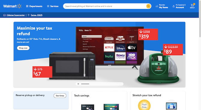 A screenshot of the Walmart home page shows a blue header bar with the logo, navigation, wide search bar, and account links. The hero image reads “Maximize your tax refund” and has photos of a microwave, carpet cleaner, and Roku TV.