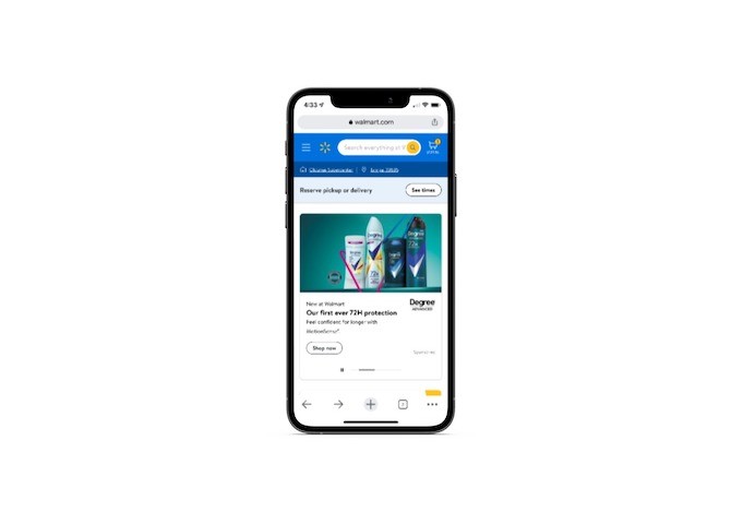 A screenshot of the Walmart.com mobile website home page. There’s a bright blue header bar at the top with a white hamburger menu icon on the left, followed by the yellow Walmart star-shaped logo, a big white search bar that says “Search everything at W”, as well as a white shopping cart icon.