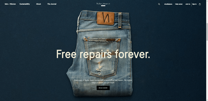 A screenshot from the home page of the Nudie Jeans website. There’s a dark, dusty-blue background with a pair of faded and ripped jeans in front of it and the words “Free repairs forever”.