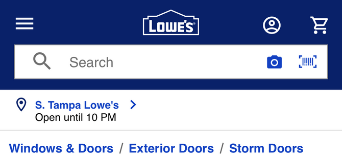 A screenshot from a product page on the Lowe’s mobile website. There are breadcrumbs between the store location and the page title for Windows & Doors / Exterior Doors / Storm Doors.