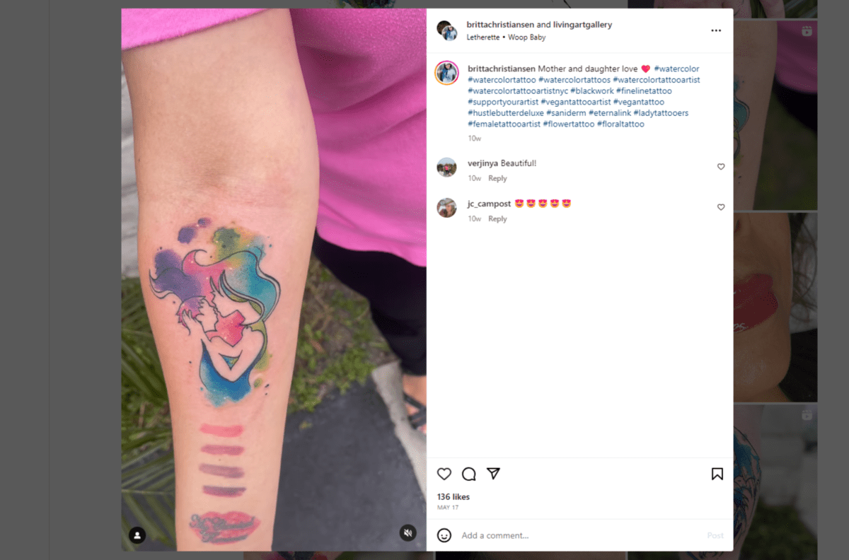 From the Instagram page of @brittachristiansen. The tattoo is of a mother kissing her daughter. A rainbow watercolor palette fills in some of the details of the two people while also bleeding outside the lines.