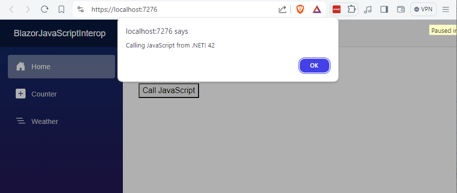 A Blazor web application with an alert dialog created by JavaScript and displaying the message 'Calling JavaScript from .NET! 42'