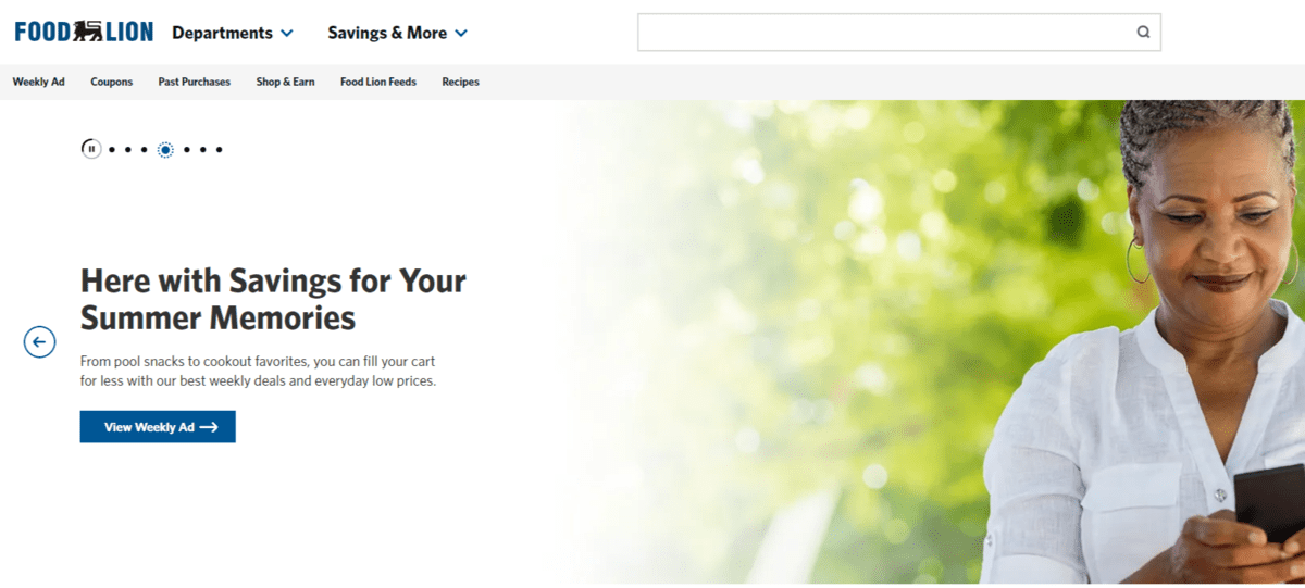 At the top of the Food Lion website, there are two dropdown menus that appear to the right of the logo. The first is Departments. The second is Savings & More.