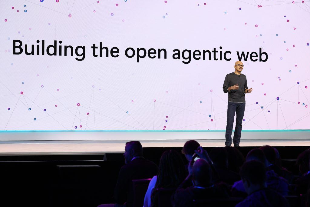Satya Nadella during the Keynote with a slide reading: Building the open agentic web