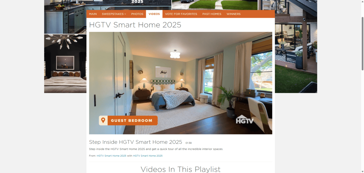In this screenshot from the HGTV Smart Home 2025 walkthrough, we see the Guest Bedroom. There’s a bed at the back of the room, two large windows to the right, a spacious area rug in the middle, and a desk in the foreground corner.