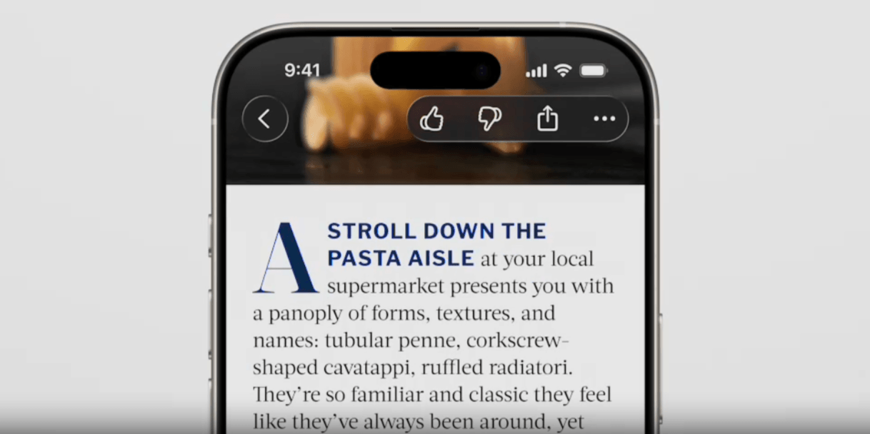 In this example of Liquid Glass, we see a back button in the top left corner of the phone screen and a toolbar in the top right with icons for Like, Dislike, Share, and More. They sit on top of a dark image within the blog post, so the glass is a blackish hue and the icons are white.