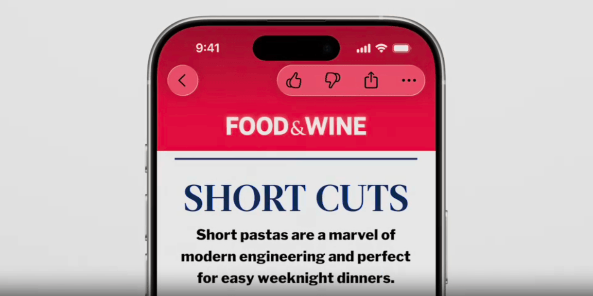 In this example of Liquid Glass, we see a back button in the top left corner of the phone screen and a toolbar in the top right with icons for Like, Dislike, Share, and More. They sit on top of the red banner at the top of the blog post, so the glass is a reddish hue and the icons are black.