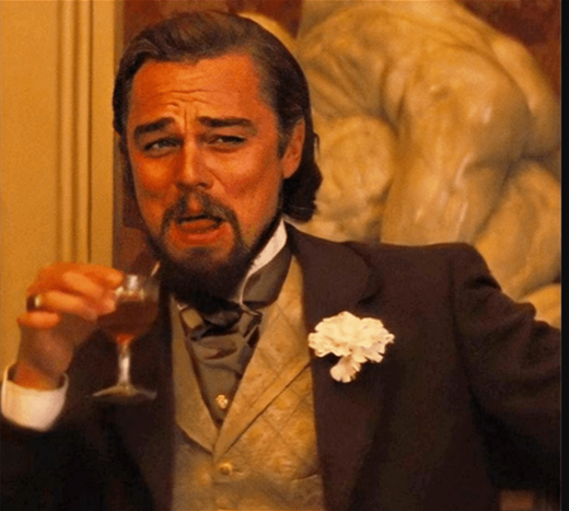 Meme of Leonardo DiCaprio laughing and drinking in Django Unchained